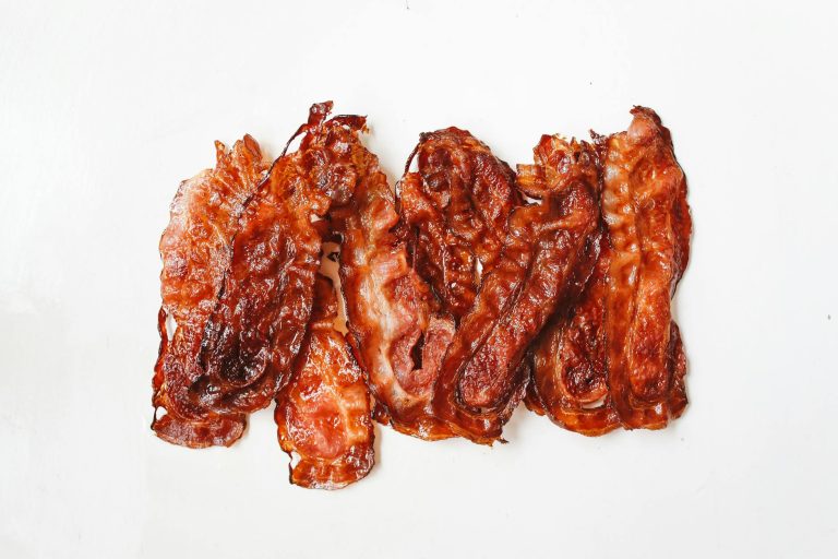 fried strips of meat on white surface